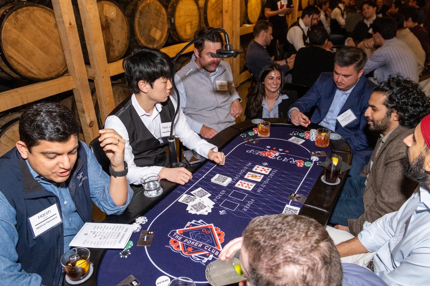 Guests playing at a Full House Vision table, with personalized player cards across the felt