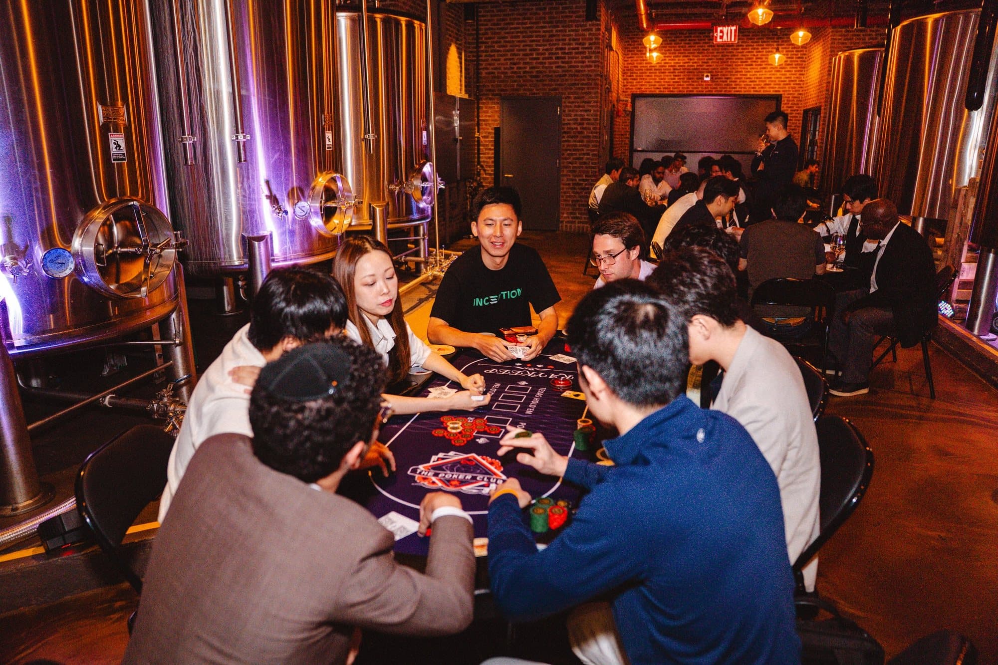 Guests playing Texas Hold'em at a Full House Vision corporate poker event in New York